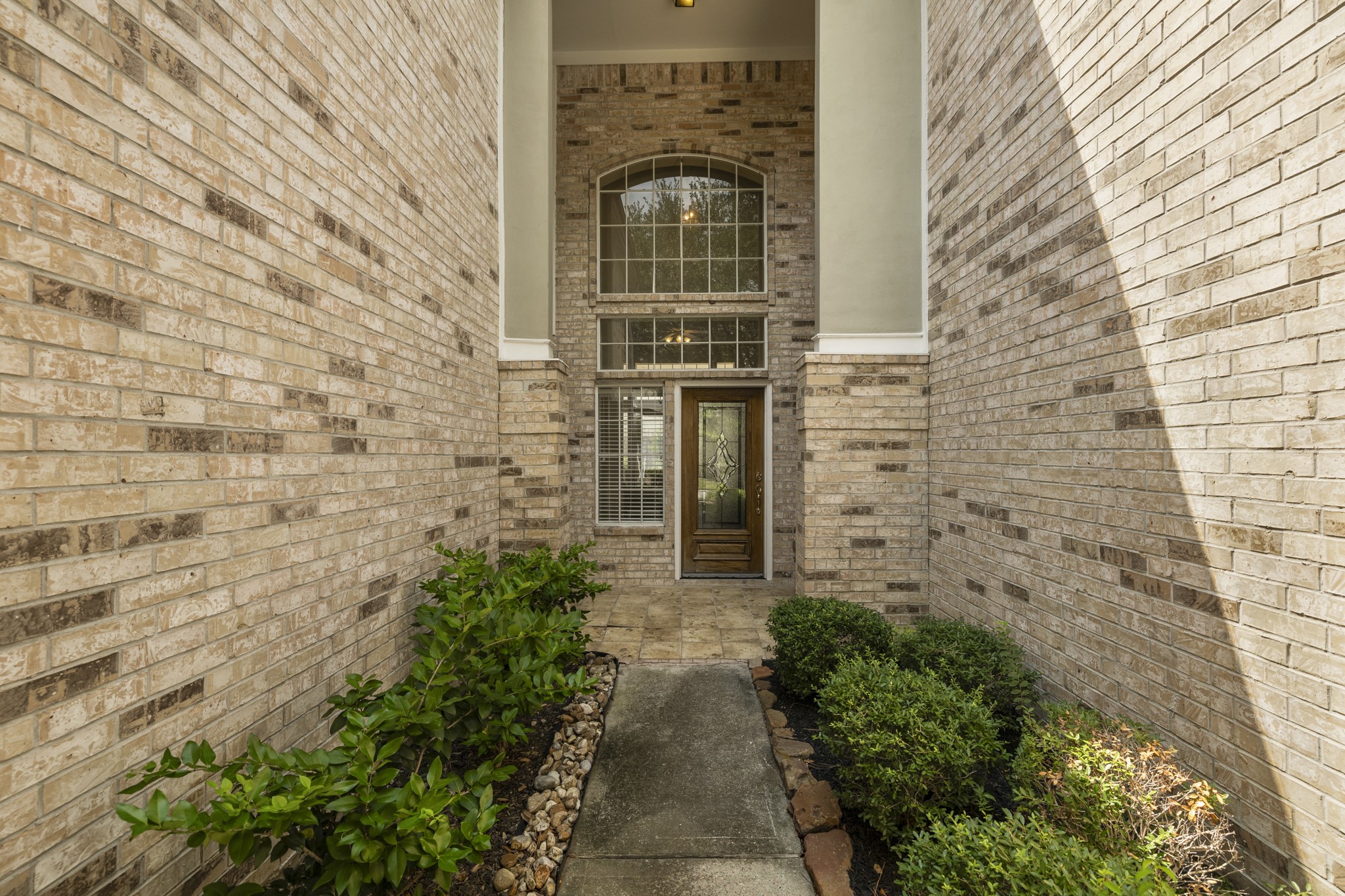 6830 Jasmine Place Spring, TX 77379 - Photo 3 of 38 a view of a pathway with a small yard