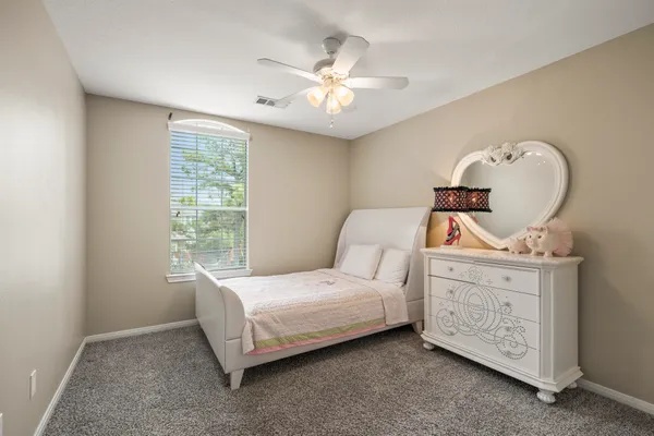 a bed room with a bed and a window