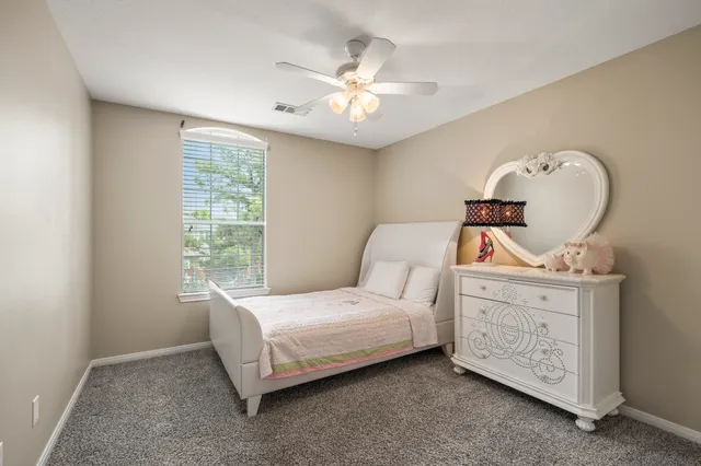 a bed room with a bed and a window