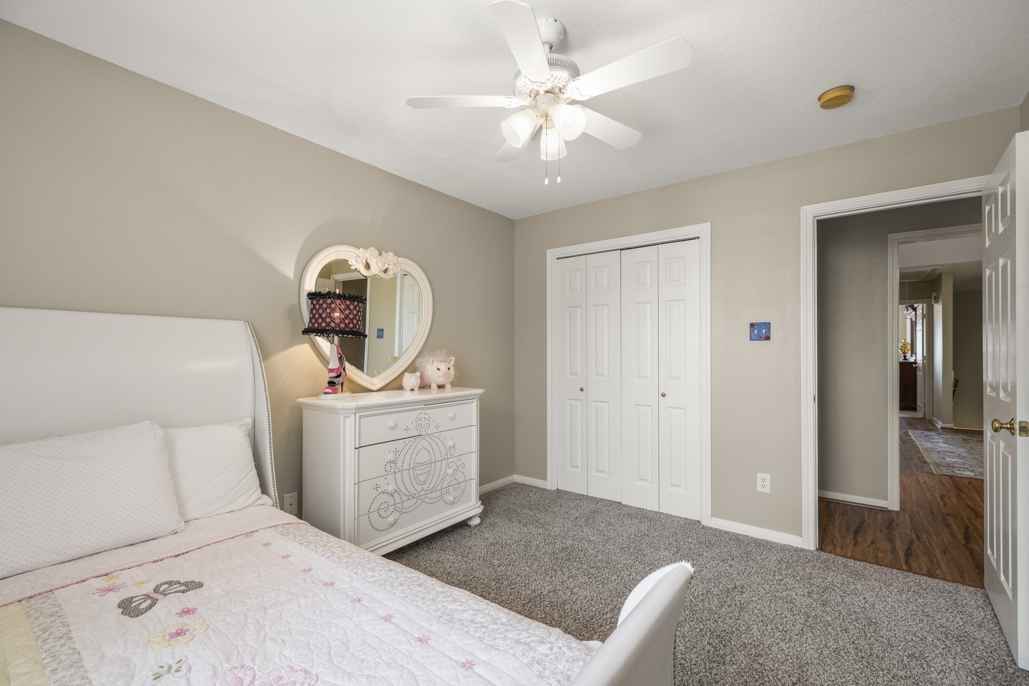 6830 Jasmine Place Spring, TX 77379 - Photo 32 of 38 a bedroom with a bed and a chandelier