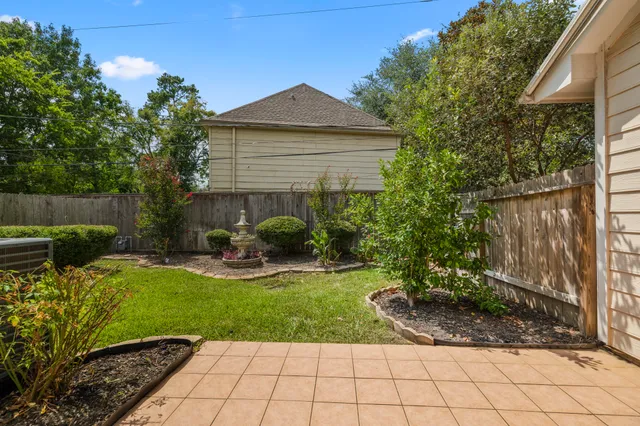 a view of a backyard with sitting area