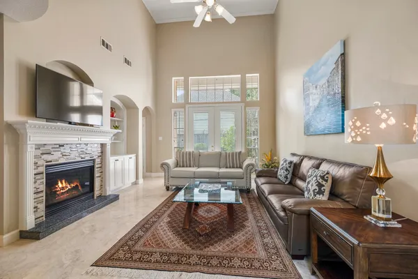 a living room with furniture and a fireplace