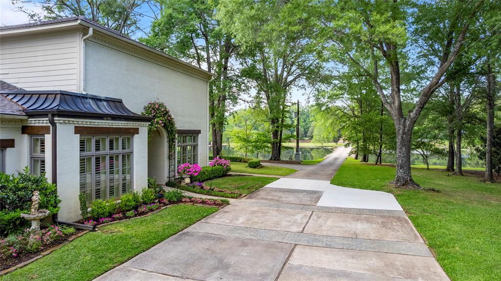 3920 Smelley Road Longview, TX 75605 - Photo 29 of 35 a view of a house with a yard and plants