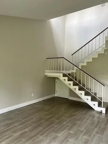 a view of entryway with wooden floor