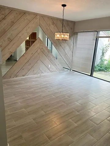 a view of a ceiling fan and window