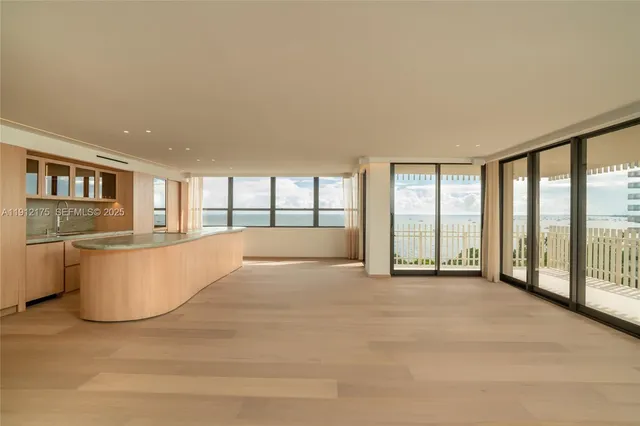 a view of an empty room and a window