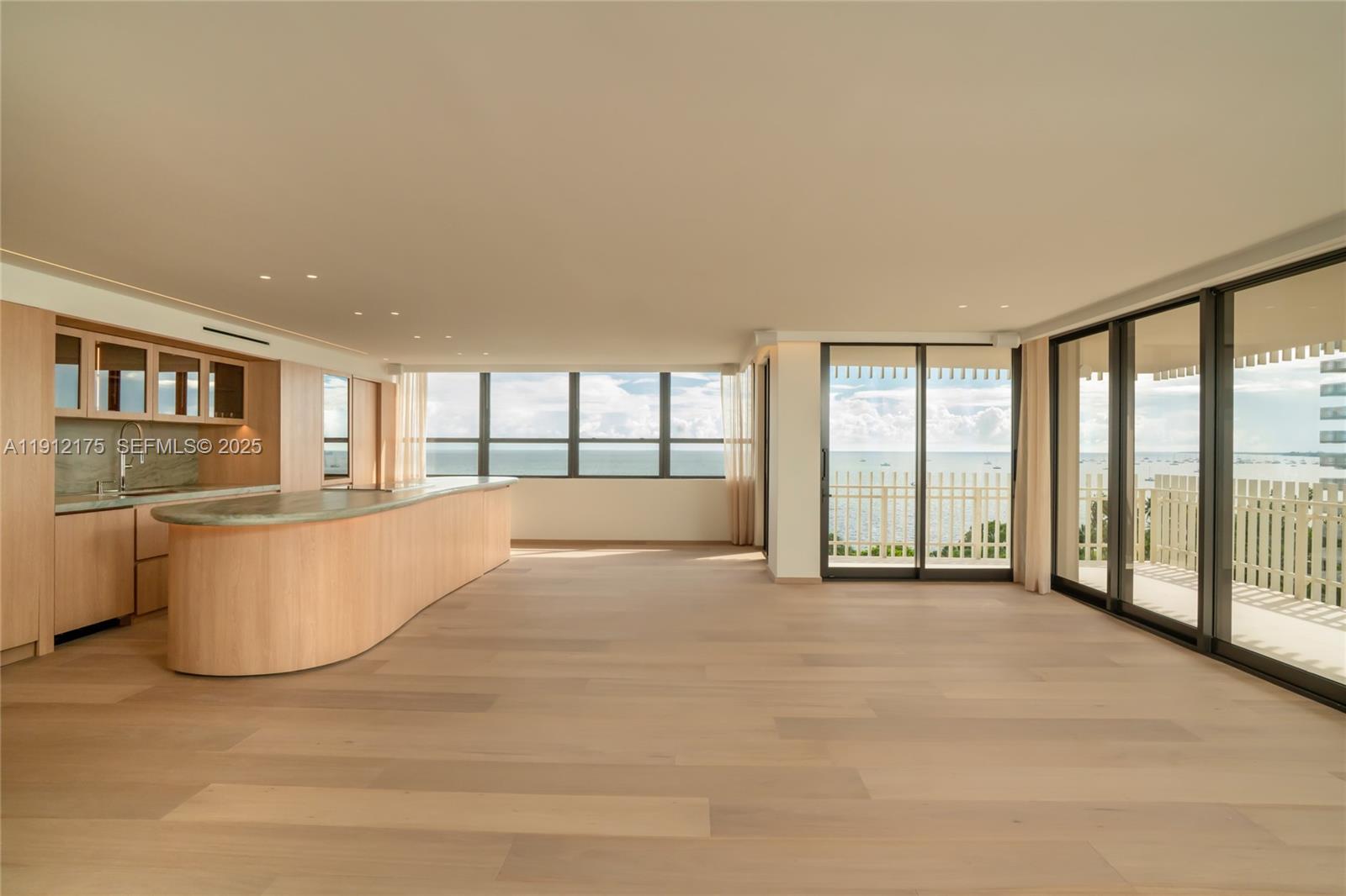 a view of an empty room and a window