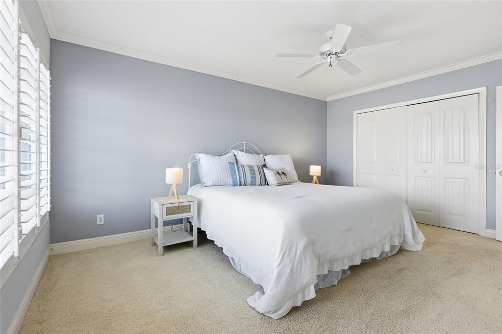 4420 Exeter Drive, Unit 303 Longboat Key, FL 34228 - Photo 12 of 42 a bedroom with bed and window