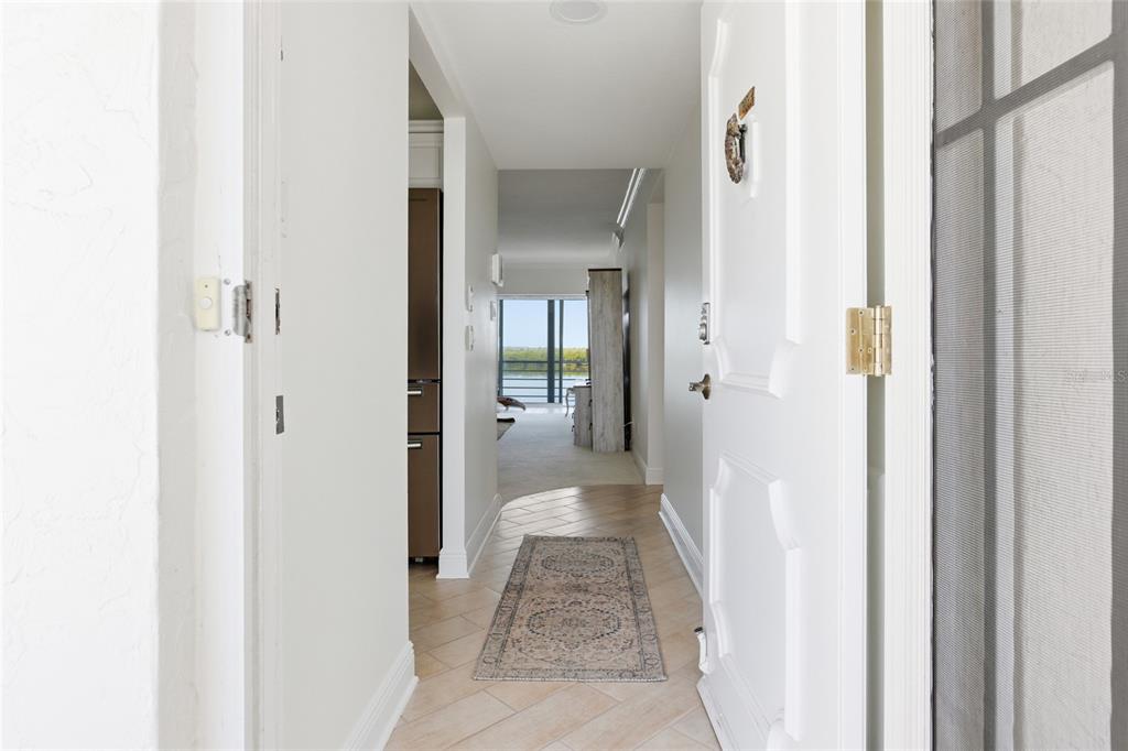 4420 Exeter Drive, Unit 303 Longboat Key, FL 34228 - Photo 2 of 42 a view of a bathroom from a hallway
