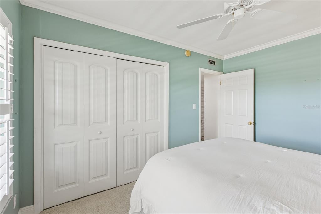 4420 Exeter Drive, Unit 303 Longboat Key, FL 34228 - Photo 22 of 42 a large white bed in a white room