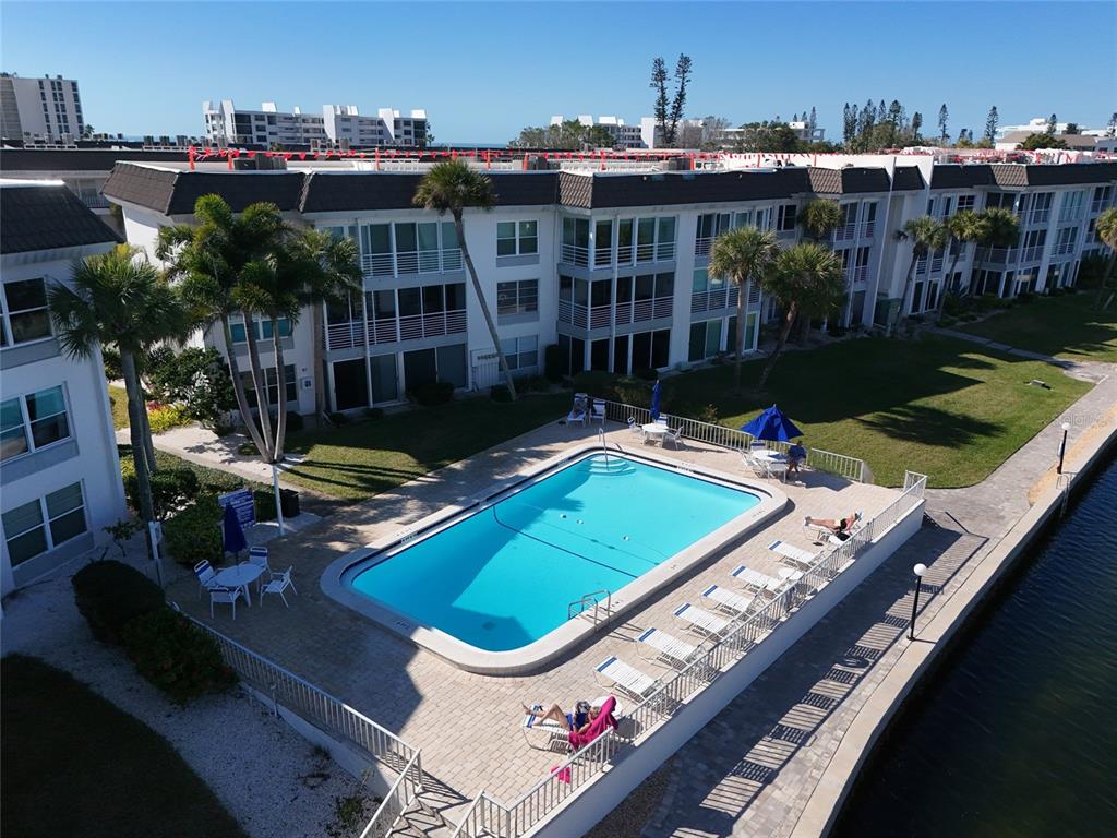 4420 Exeter Drive, Unit 303 Longboat Key, FL 34228 - Photo 26 of 42 a view of a chairs and table in patio