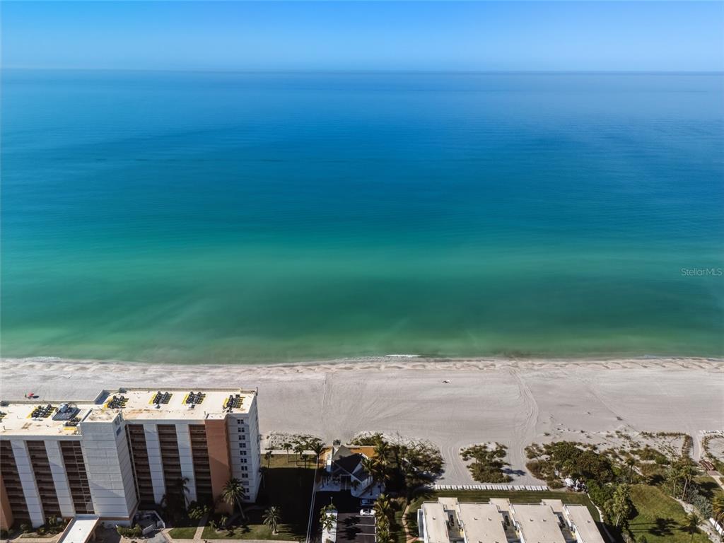 4420 Exeter Drive, Unit 303 Longboat Key, FL 34228 - Photo 29 of 42 a view of a lake with tall buildings