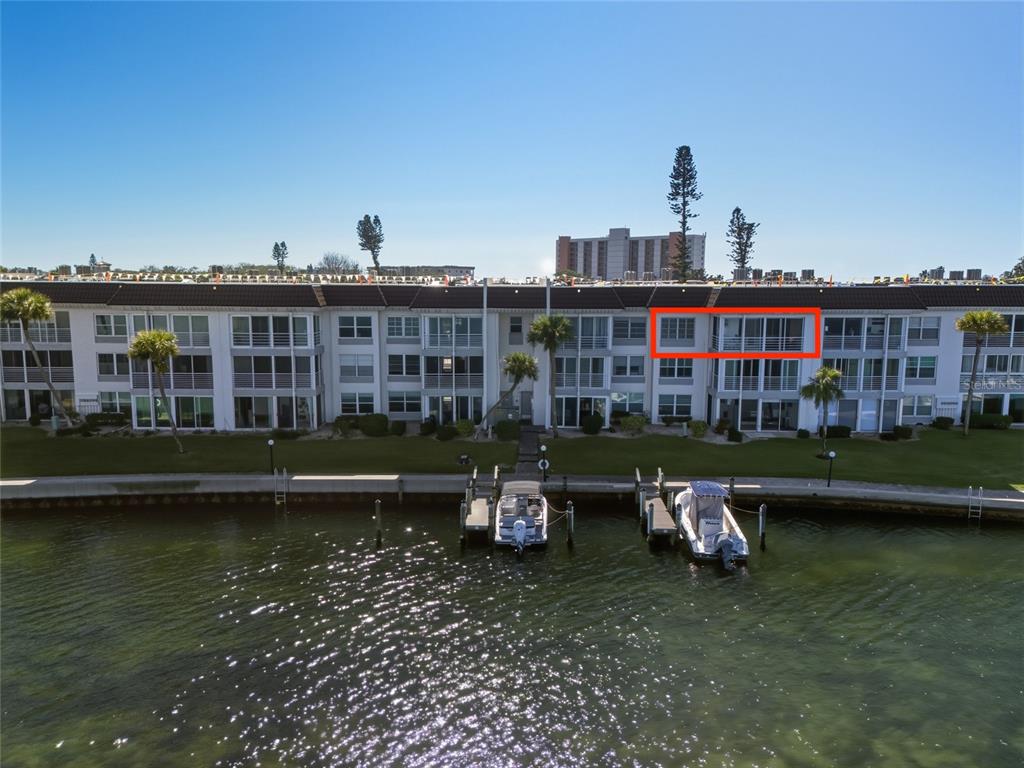4420 Exeter Drive, Unit 303 Longboat Key, FL 34228 - Photo 42 of 42 a front view of a house with a yard