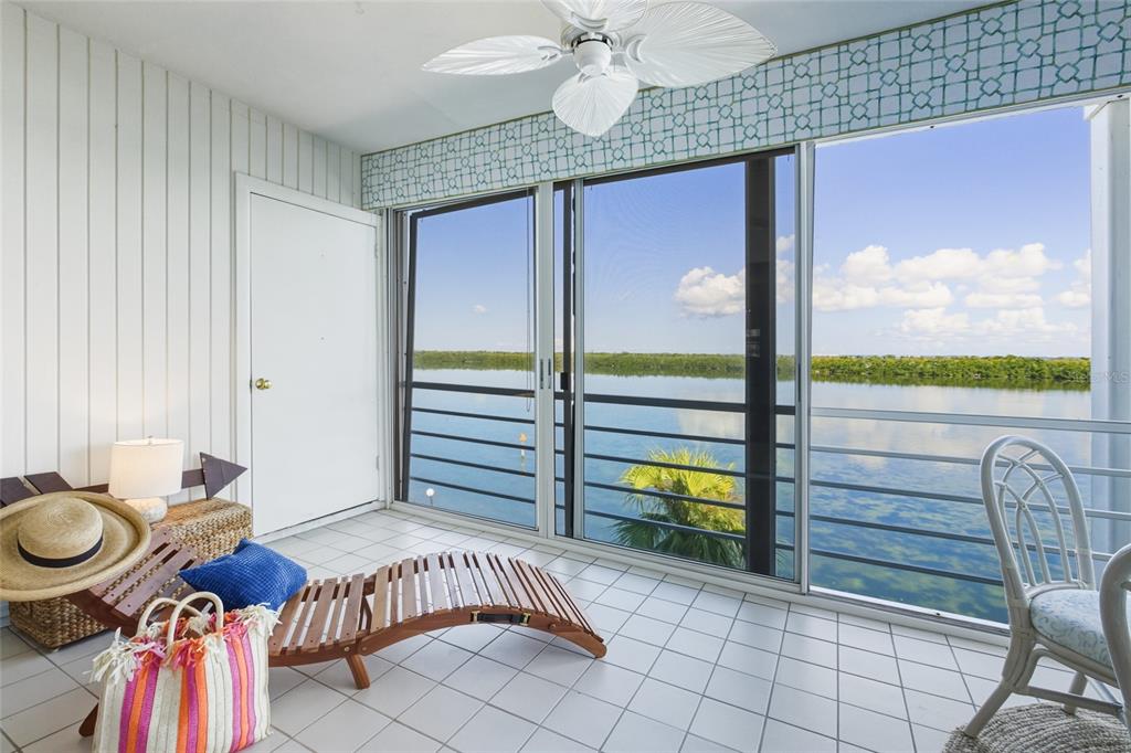 4420 Exeter Drive, Unit 303 Longboat Key, FL 34228 - Photo 6 of 42 a view of a livingroom with furniture and window