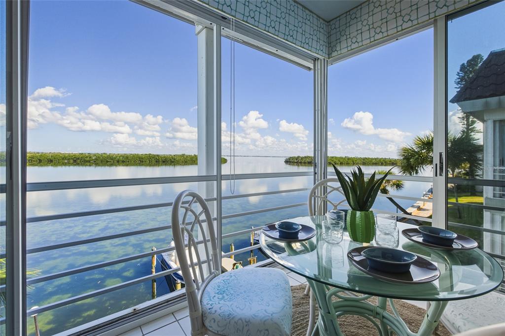 4420 Exeter Drive, Unit 303 Longboat Key, FL 34228 - Photo 7 of 42 a view of living room with furniture and floor to ceiling window