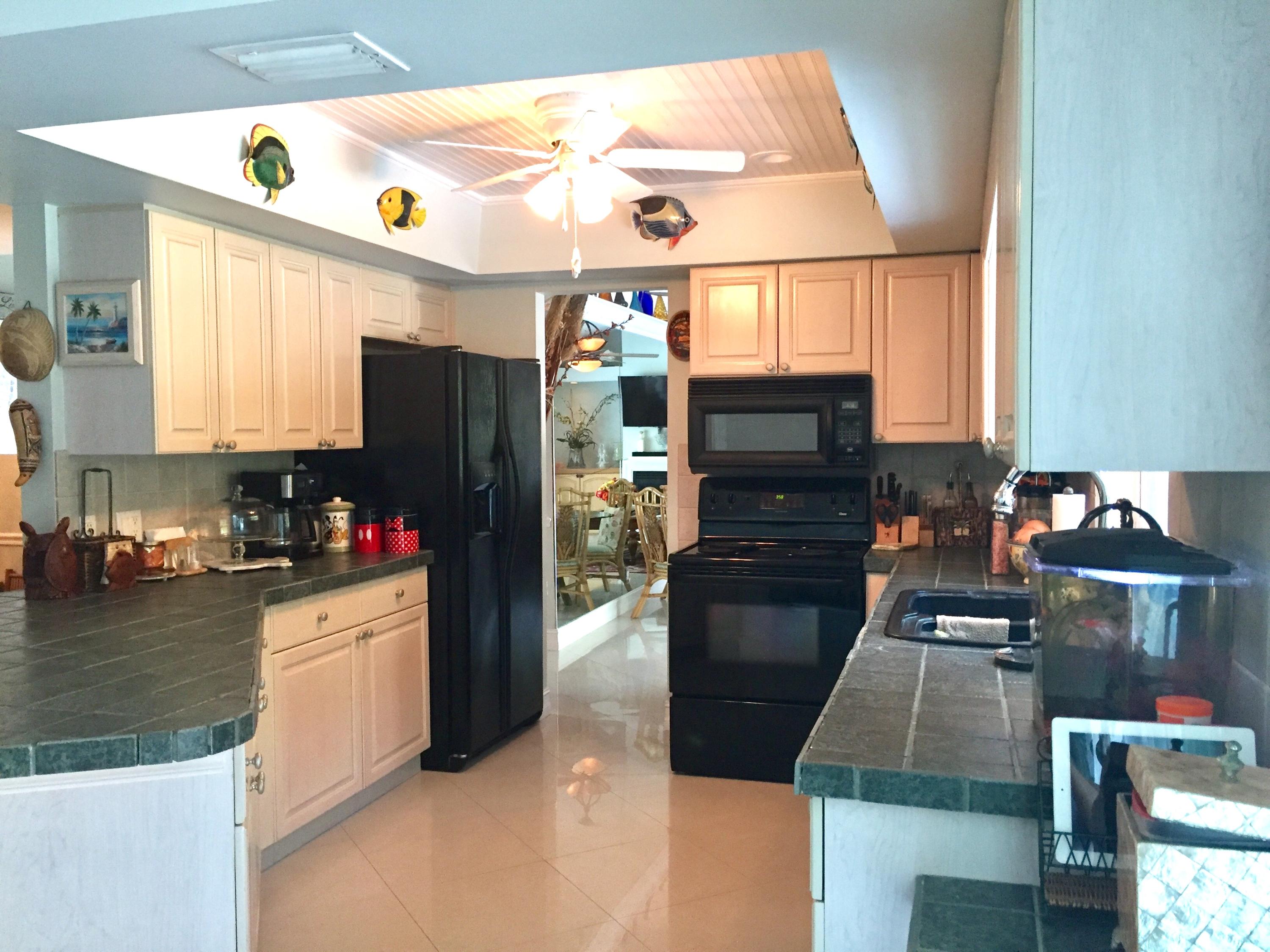 6887 Southwest Garnett Drive Stuart, FL 34997 - Photo 19 of 32 Open Kitchen