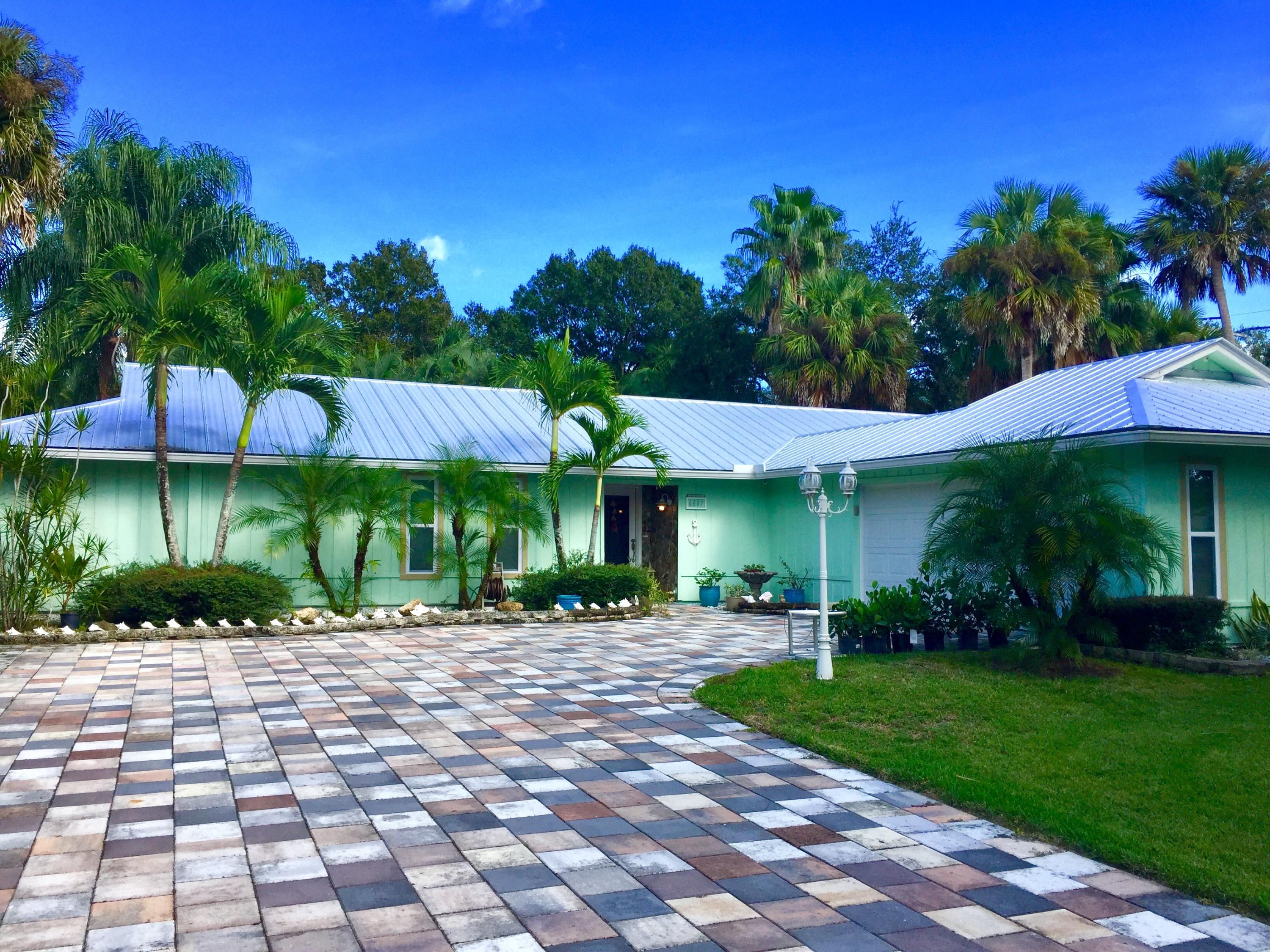 6887 Southwest Garnett Drive Stuart, FL 34997 - Photo 2 of 32 Front