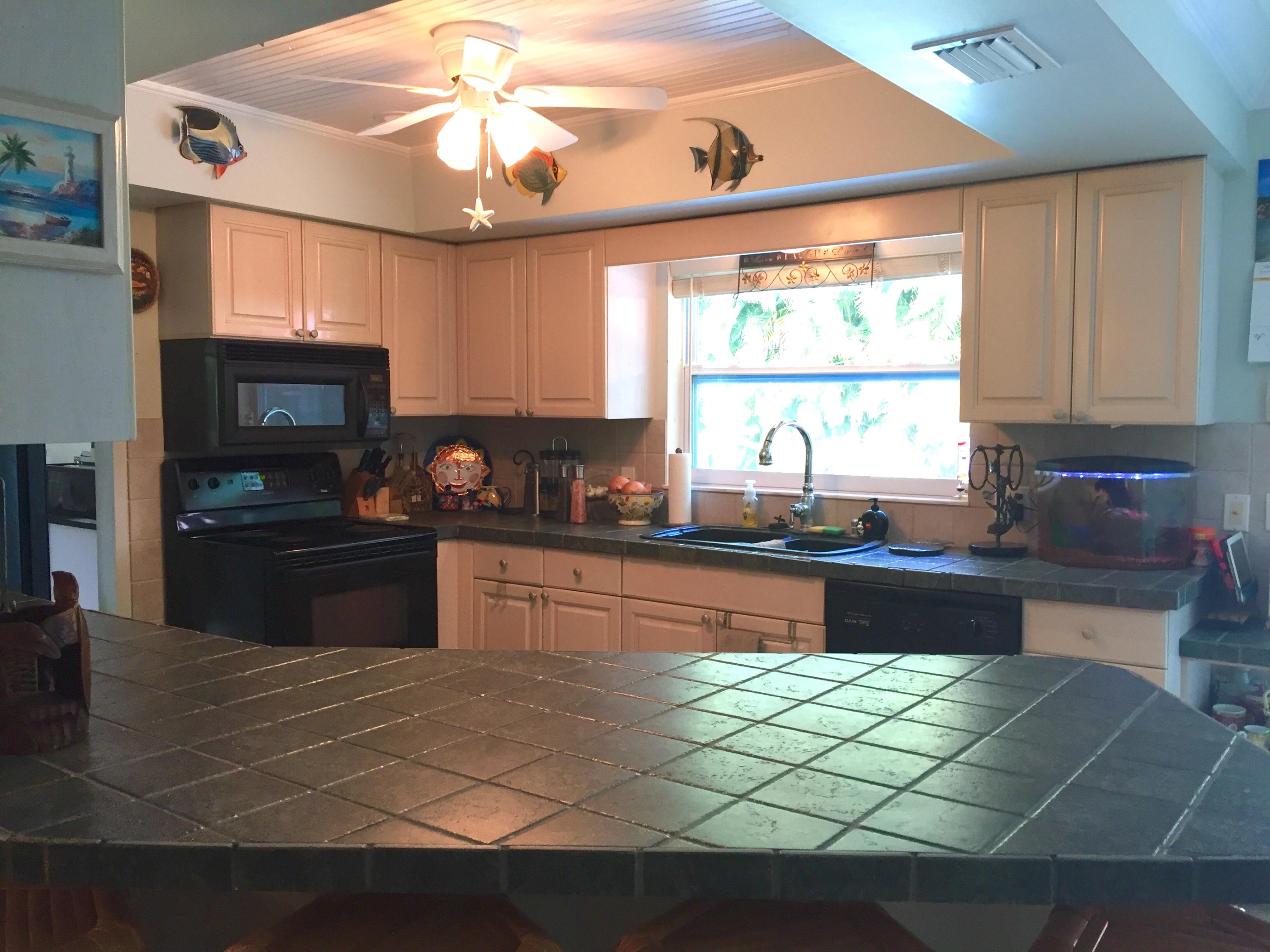 6887 Southwest Garnett Drive Stuart, FL 34997 - Photo 22 of 32 Open Kitchen