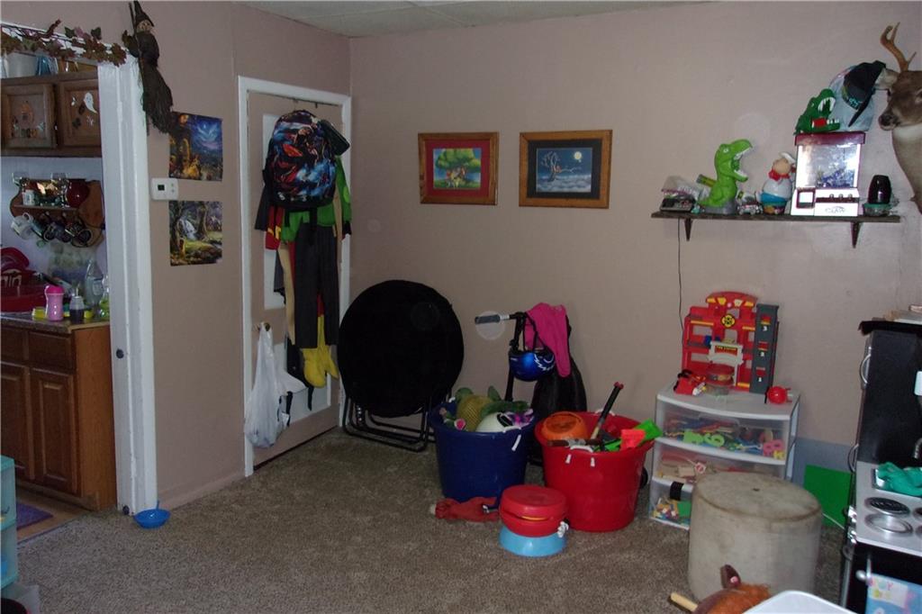 15 Murphy Street Uniontown, PA 15401 - Photo 4 of 7 a room with gym equipment and a potted plant