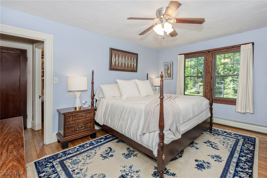 2985 Coleridge Road Cleveland, OH 44118 - Photo 25 of 46 Bedroom with wood finished floors, baseboard heating, and ceiling fan