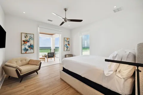 a bedroom with a bed couch and window