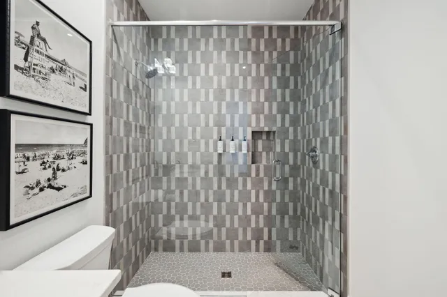 a bathroom with a shower curtain and a toilet