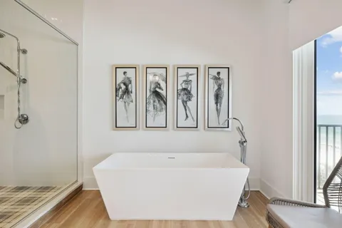 a white bath tub sitting next to a window
