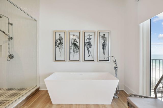a white bath tub sitting next to a window