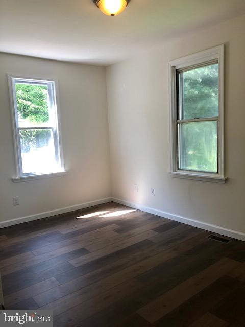 43 California Avenue, Unit A Clementon, NJ 08021 - Photo 8 of 11 a view of an empty room with wooden floor and a window