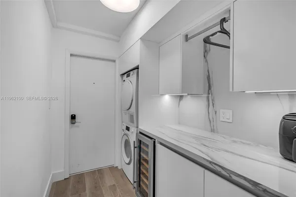 a kitchen with a sink and refrigerator