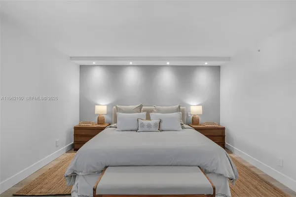 a bed room with a bed and a night stand