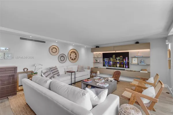 a living room with furniture and a bookshelf