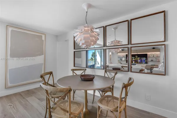 a dining room with furniture window and outside view