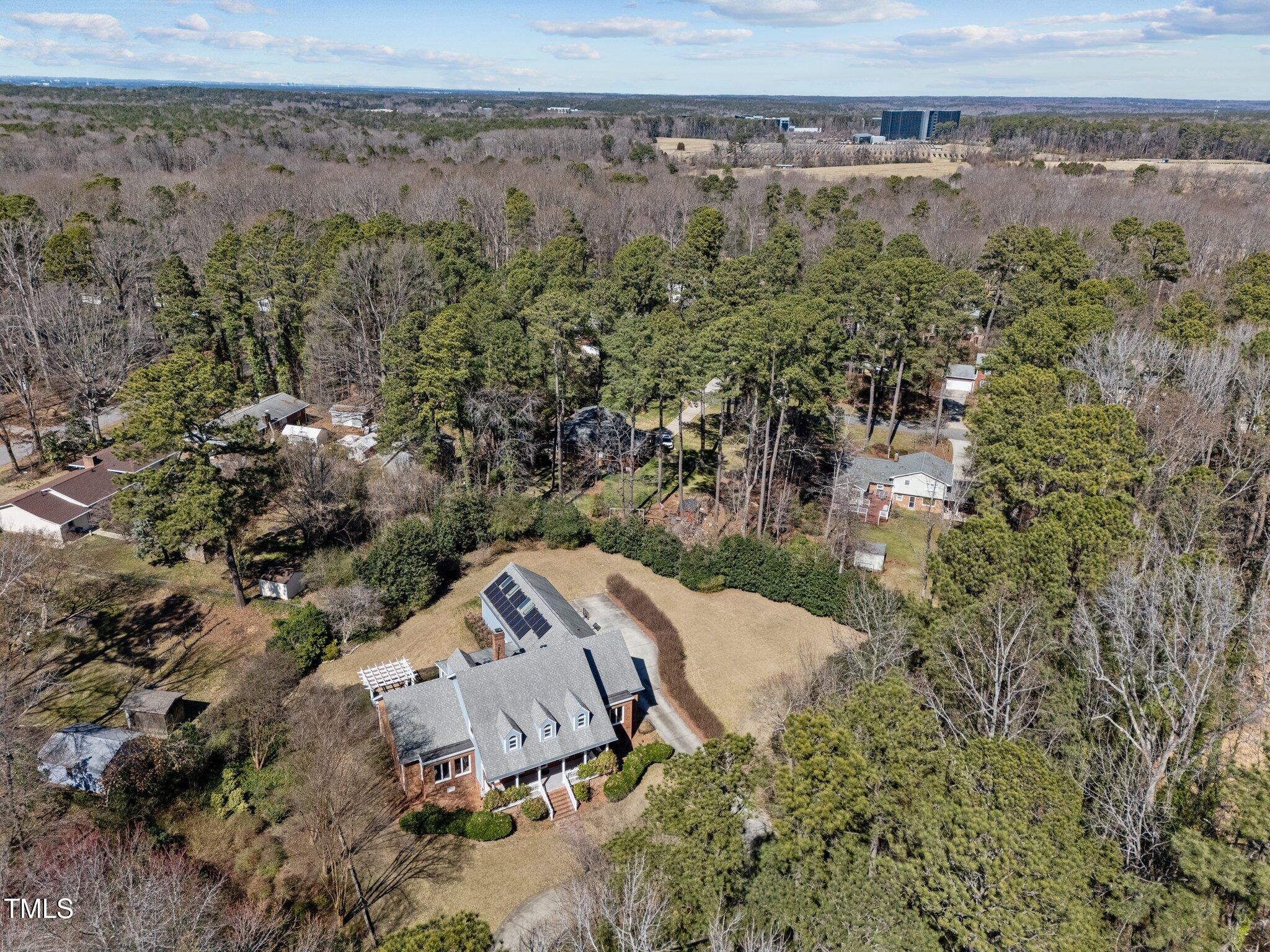 6336 Wrenwood Avenue Raleigh, NC 27607 - Photo 54 of 57 an aerial view of a house with a yard and lake view