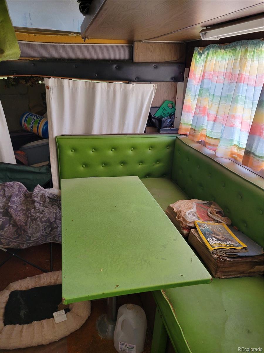 6185 Hart Road Alamosa, CO 81101 - Photo 2 of 19 a room with furniture and a window