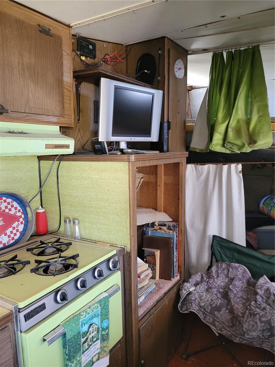 6185 Hart Road Alamosa, CO 81101 - Photo 3 of 19 a living room with furniture and a flat screen tv