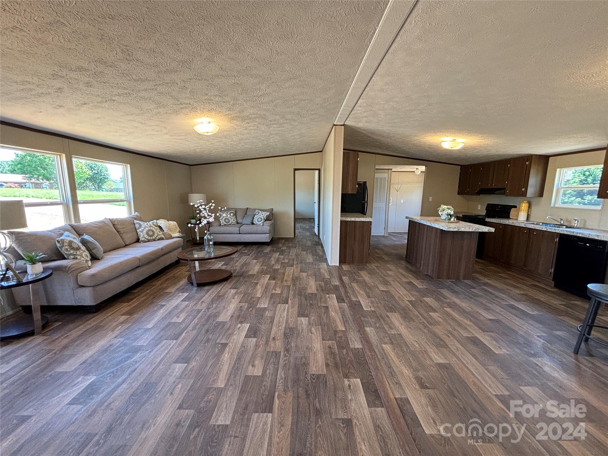 4805 Troy Road Hudson, NC 28638 - Photo 3 of 36 a living room with furniture and a wooden floor