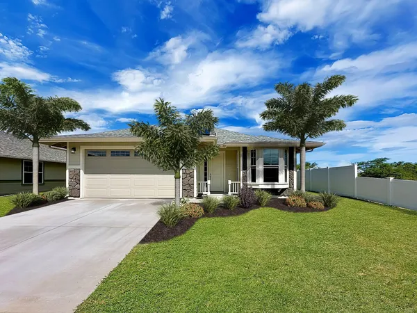 a front view of a house with yard