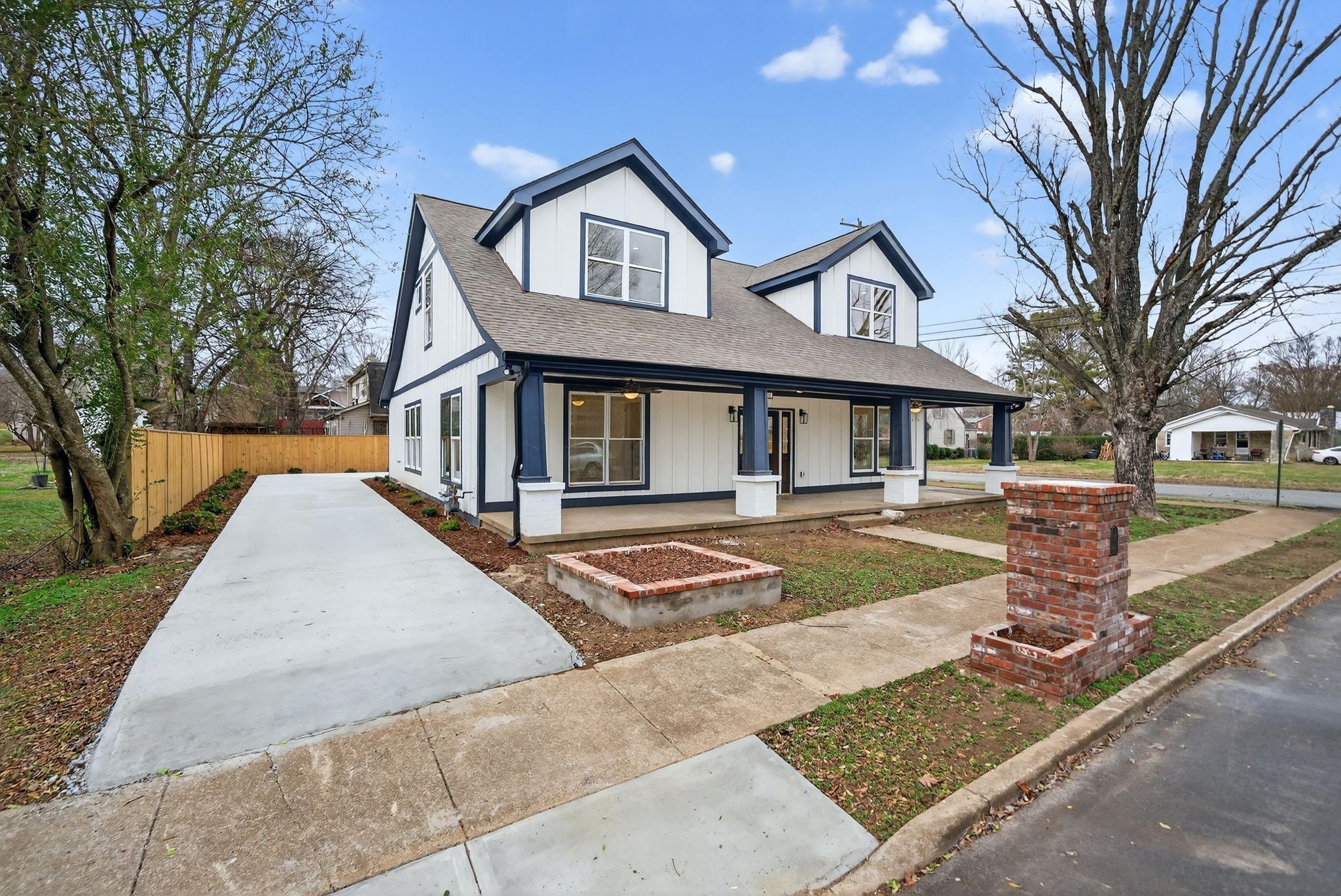410 3rd Avenue Fayetteville, TN 37334 - Photo 2 of 49 a front view of a house with yard and trees