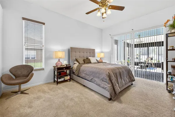 a bed room with a bed and a chair