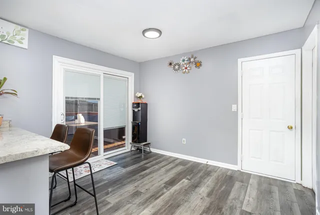 a livingroom with furniture and wooden floor