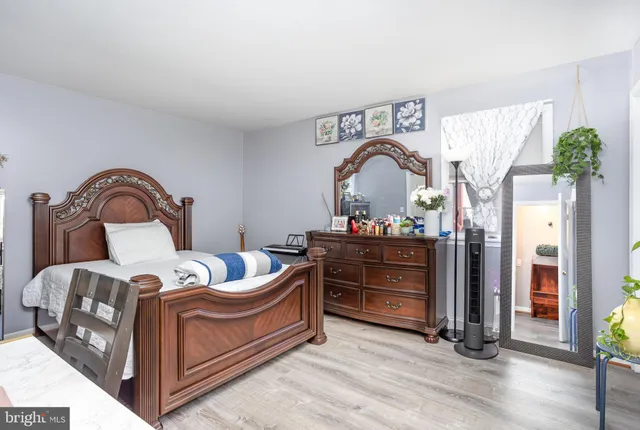 a bedroom with a bed and furniture