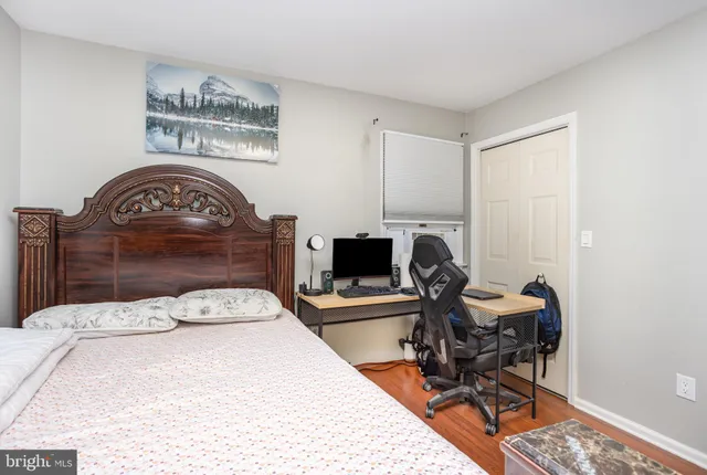 a bed room with furniture and a flat screen tv