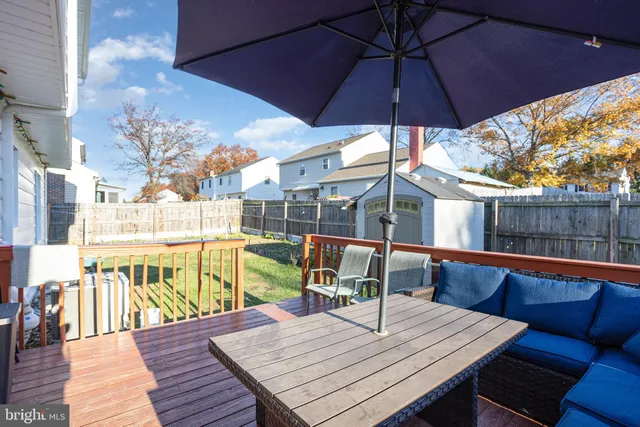 a view of a house with swimming pool and sitting area