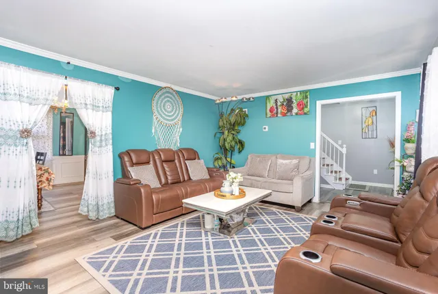 a living room with furniture and a rug