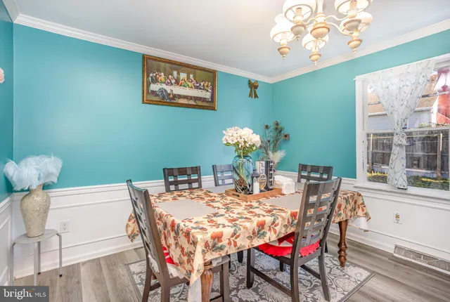 a dining room with furniture and window