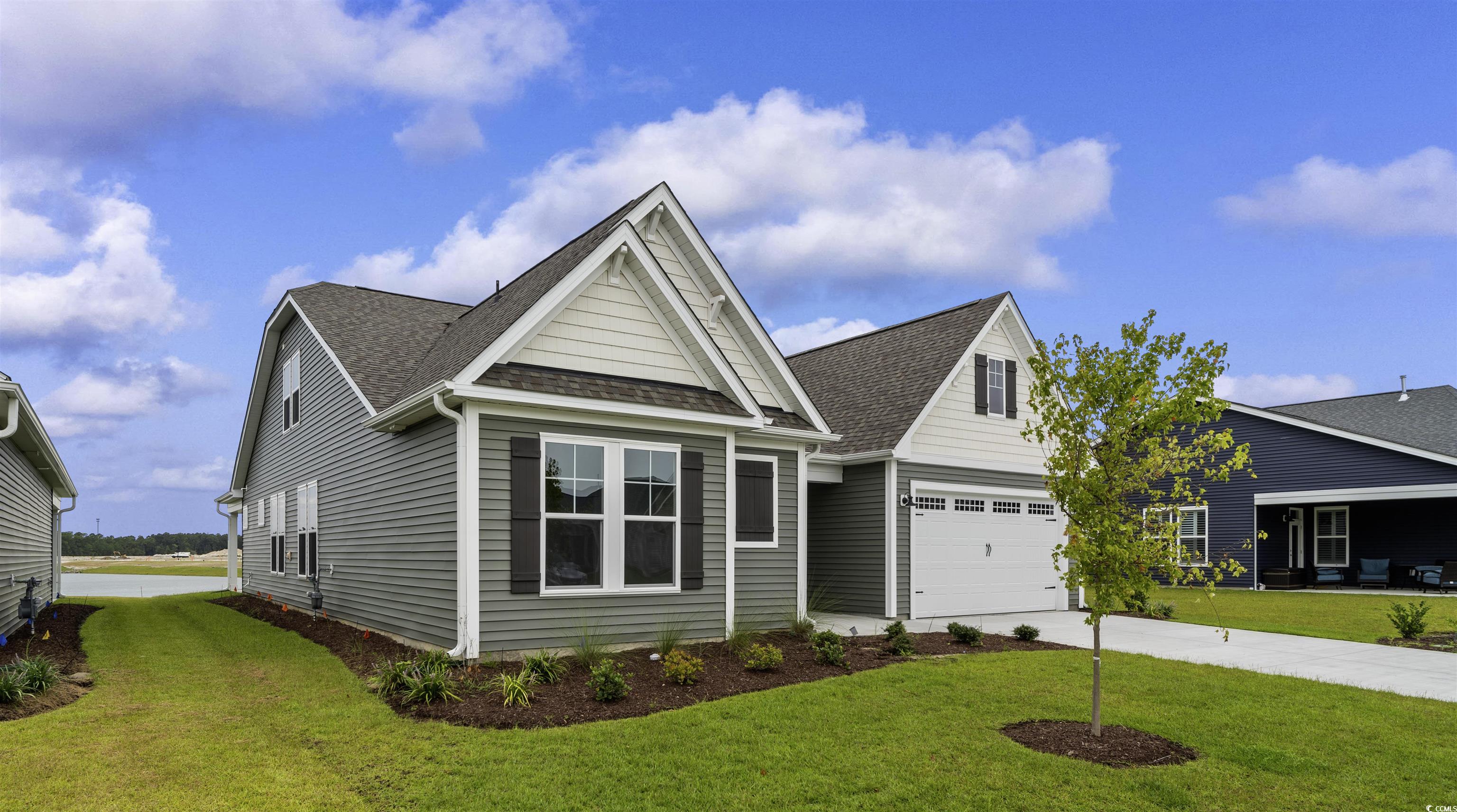 1906 Woodrush Loop Little River, SC 29566 - Photo 2 of 40 View of front of home with a front yard and a garage
