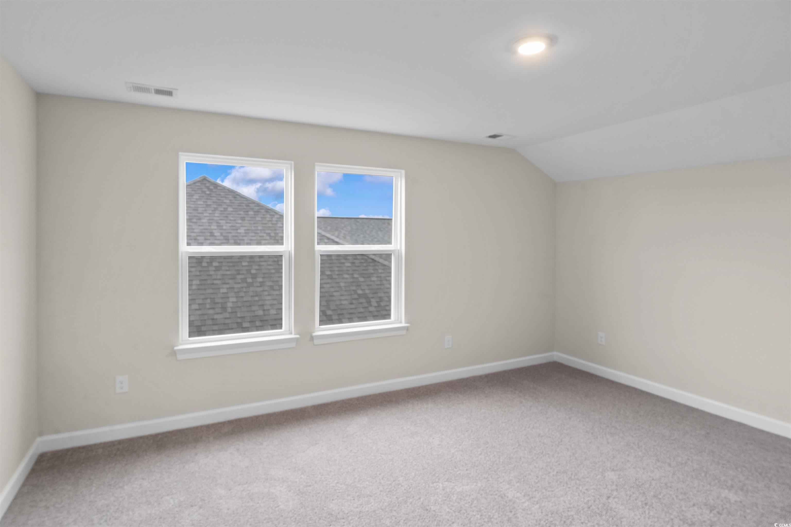 1906 Woodrush Loop Little River, SC 29566 - Photo 30 of 40 Additional living space featuring lofted ceiling and carpet