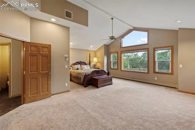 a living room with furniture a ceiling fan and a window
