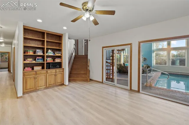 a view of empty room with cabinet and floor to ceiling window